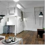 A lakás belseje egyszerű és ízléses: a szobák visszapillantott stílusú kialakításának fotója