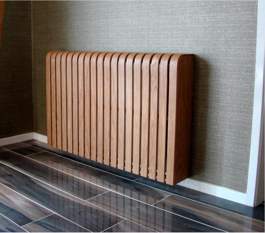 A radiátorok fából készült dekorációs képernyői legjobban teljesíthetik dekoratív funkciójukat.