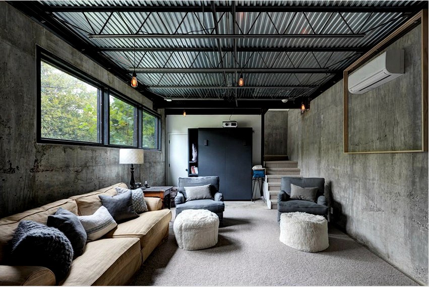 A nyers beton falak tökéletesen illeszkednek a loft stílusú nappali belső kialakításához.